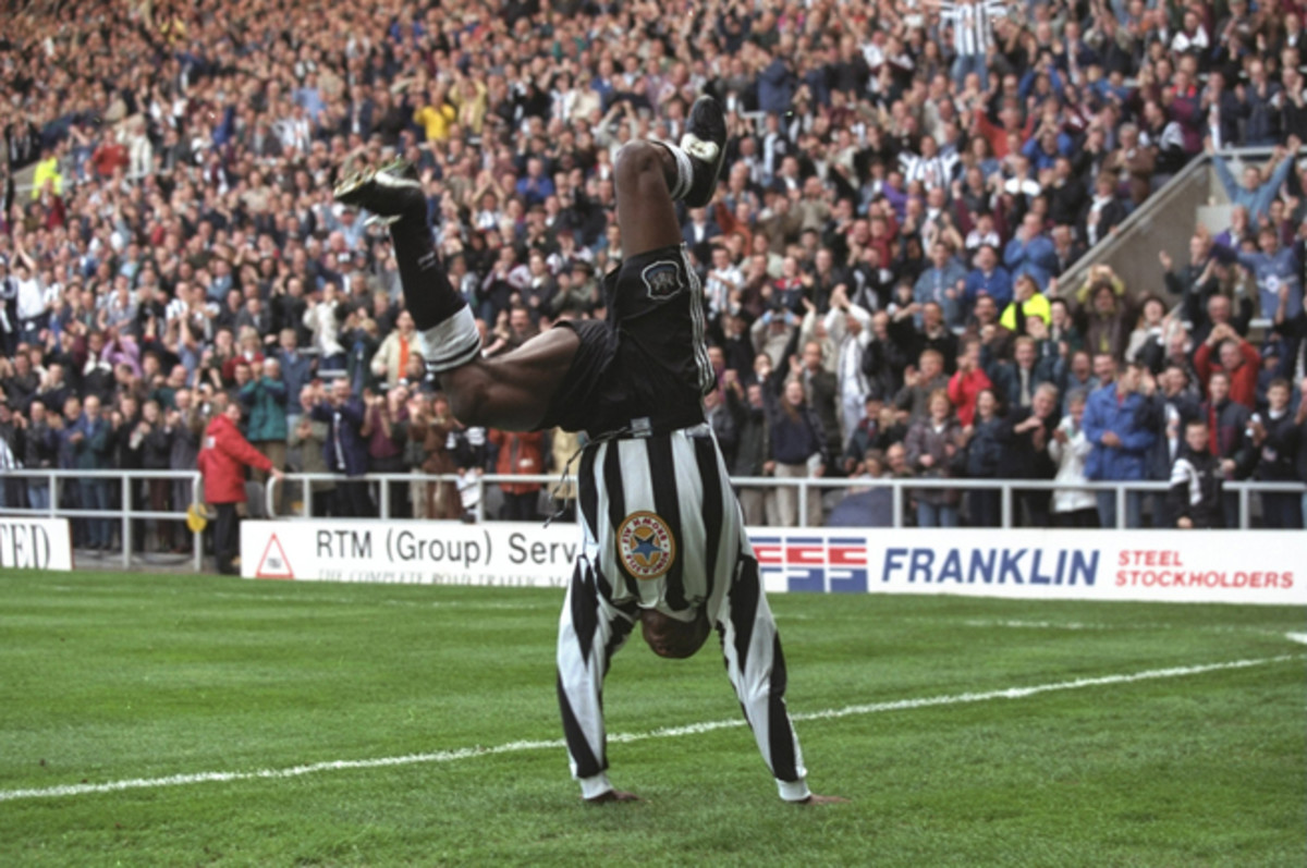 Faustino Asprilla goes into an extravagant goal celebration after scoring for Newcastle.