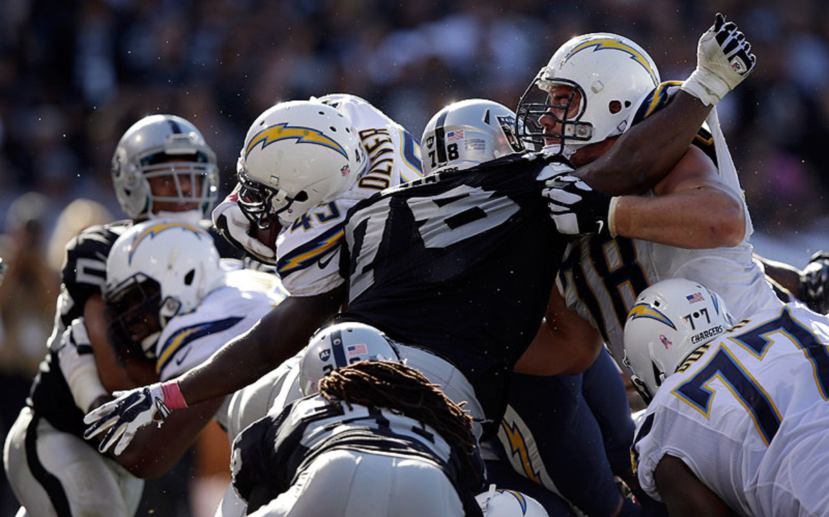 Branden Oliver's 1-yard touchdown in the fourth quarter helped give the Chargers a win over the Raiders in Oakland. (Ezra Shaw/Getty Images)