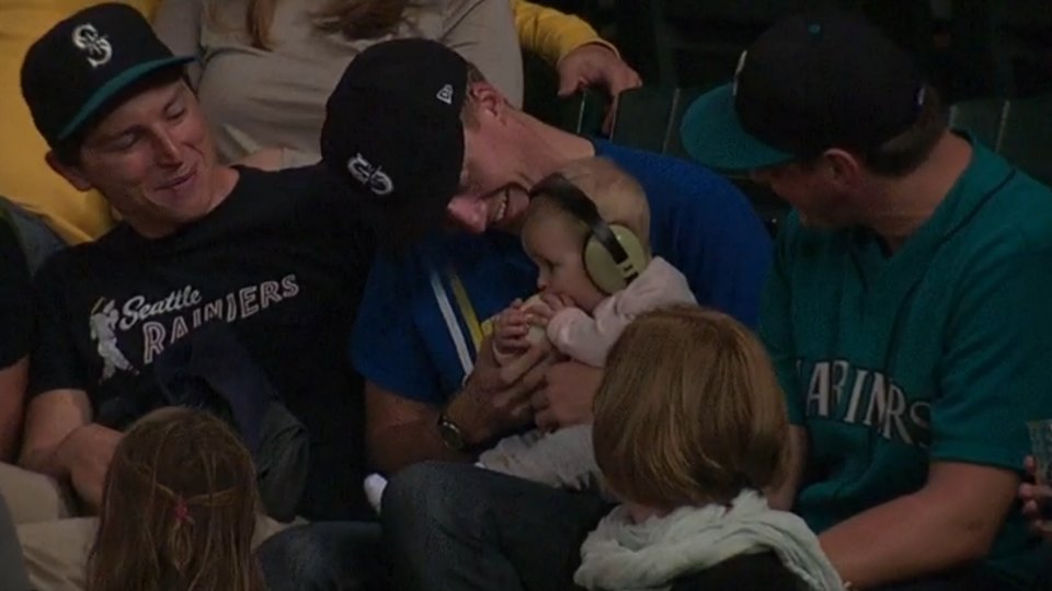 Seattle Mariners fan lets his adorable baby try to eat a baseball