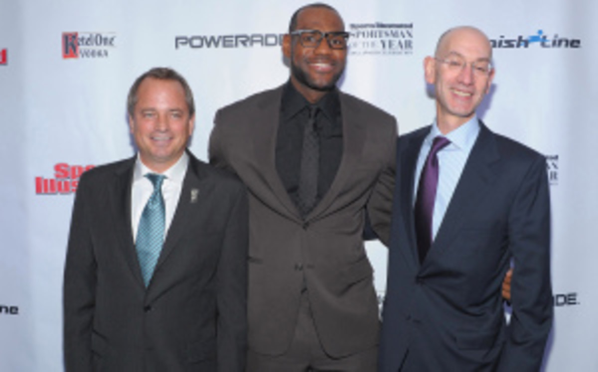LeBron James, pictured here at the 2012 ceremony to recognize him as Sports Illustrated's Sportsman of the Year, hinted on Tuesday at looking to put pressure on incoming commissioner Adam Silver (right) to further globalize the game. (Michael Loccisano/Getty Images)
