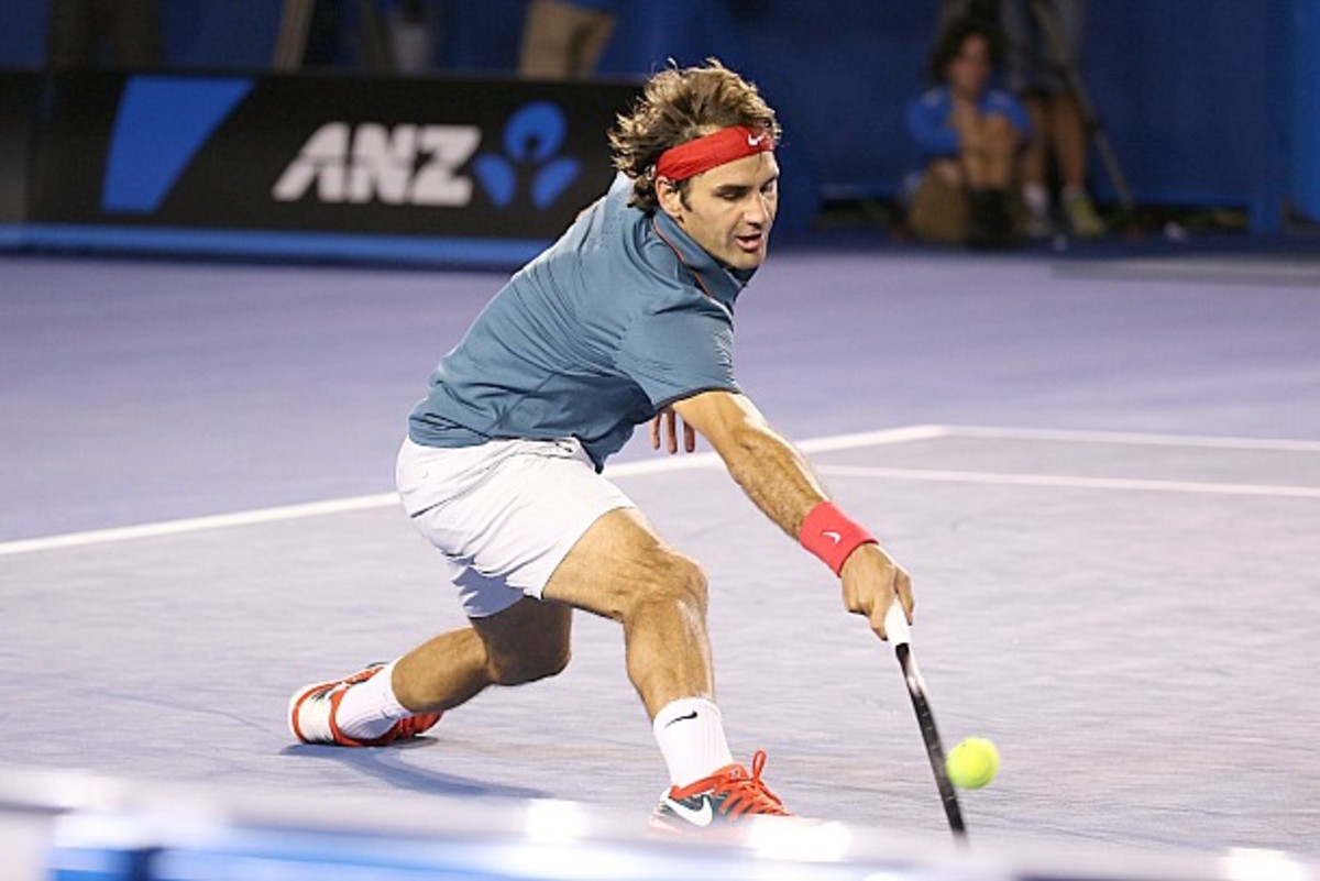 Federer defends. (Michael Dodge/Getty Images)