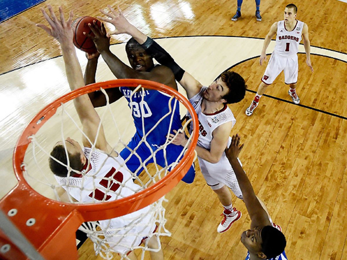 Julius Randle and Kentucky have been battling with Frank Kaminsky and Wisconsin. (Pool/Getty Images)