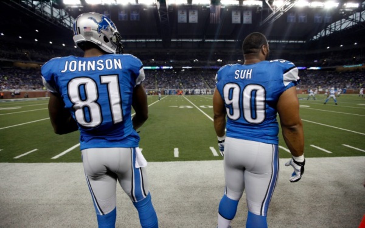 Lions teammates Calvin Johnson and Ndamukong Suh topped a survey for very different reason (AP Photo/Paul Sancya)