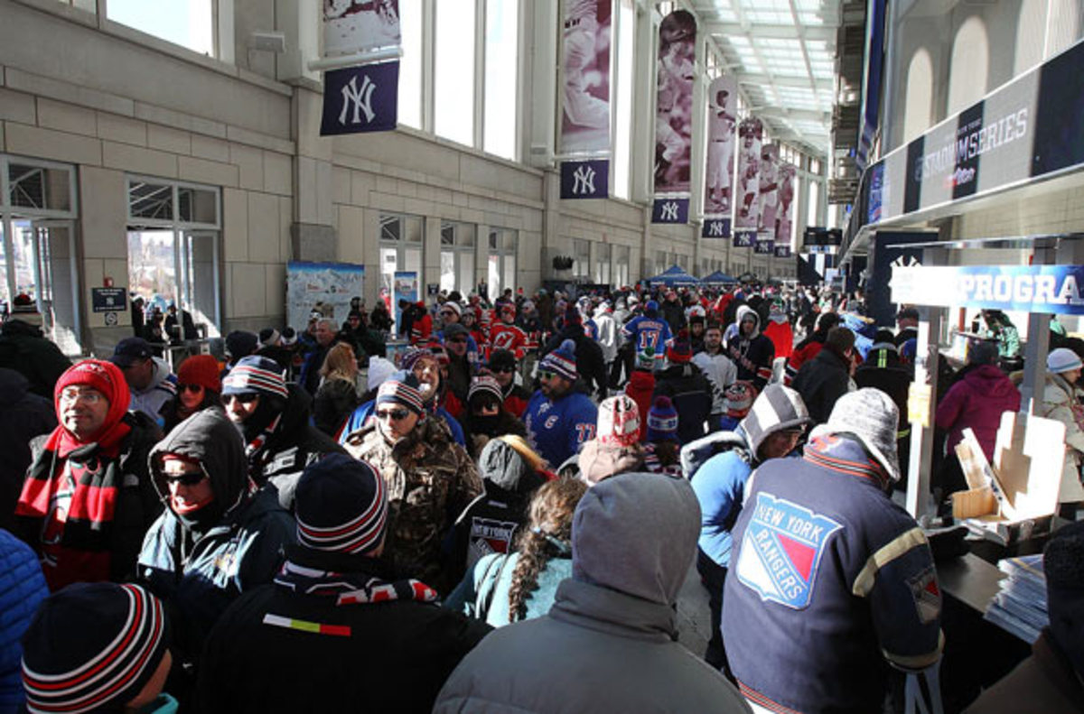 The Yankee Stadium concourse is packed by fans for the NHL outdoor game between the New York Rangers and New Jersey Devils.