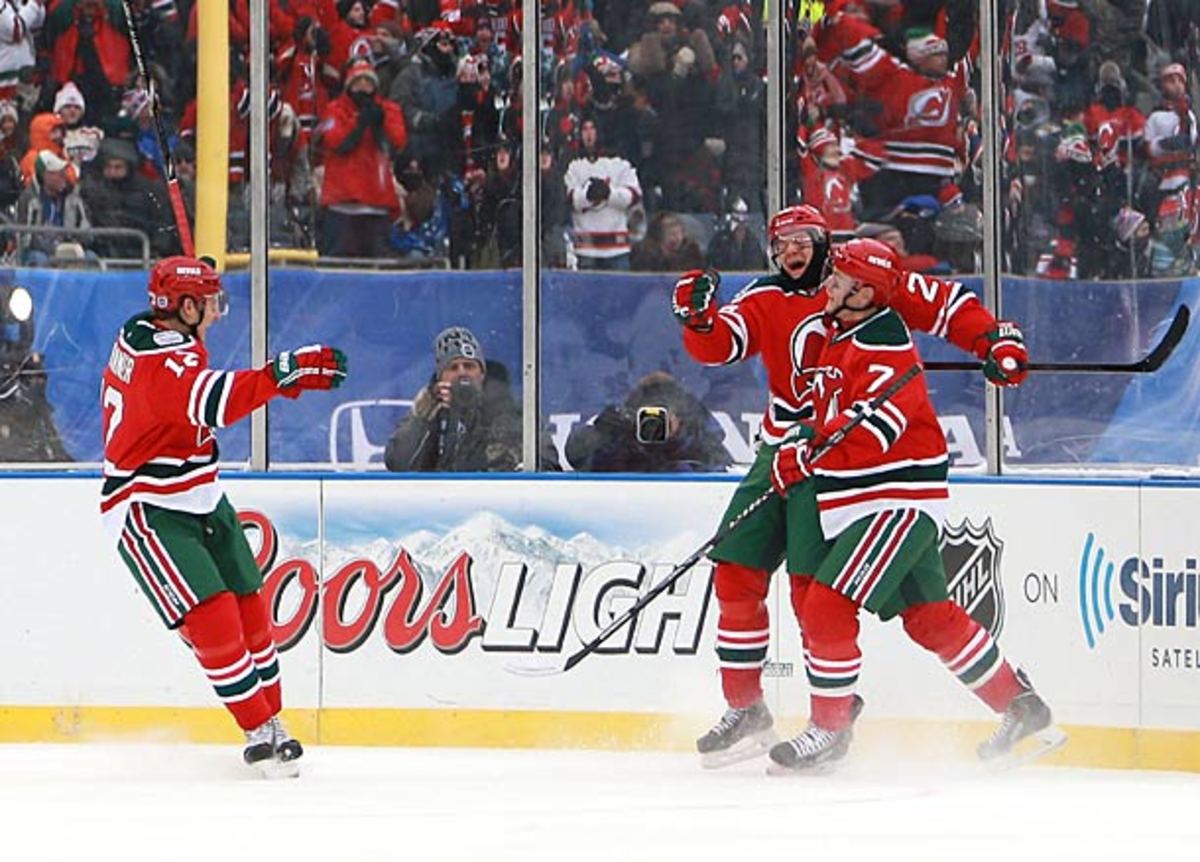 Patrik Elias and the Devils celebrate a goal in their NHL outdoor game at Yankee Stadium.