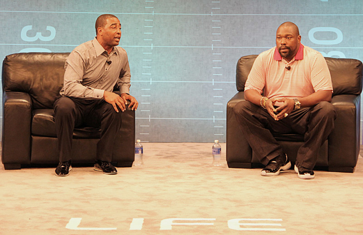 Carter (left) and Sapp were seated when their talk started. They didn't stay seated for long. (Courtesy of the NFL)
