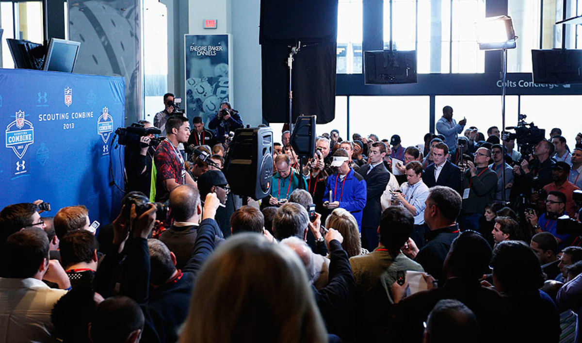 The crowd around Manti Te'o at last year's combine will be similar in size to the one Michael Sam sees in Indy this week. (Joe Robbins/Getty Images)