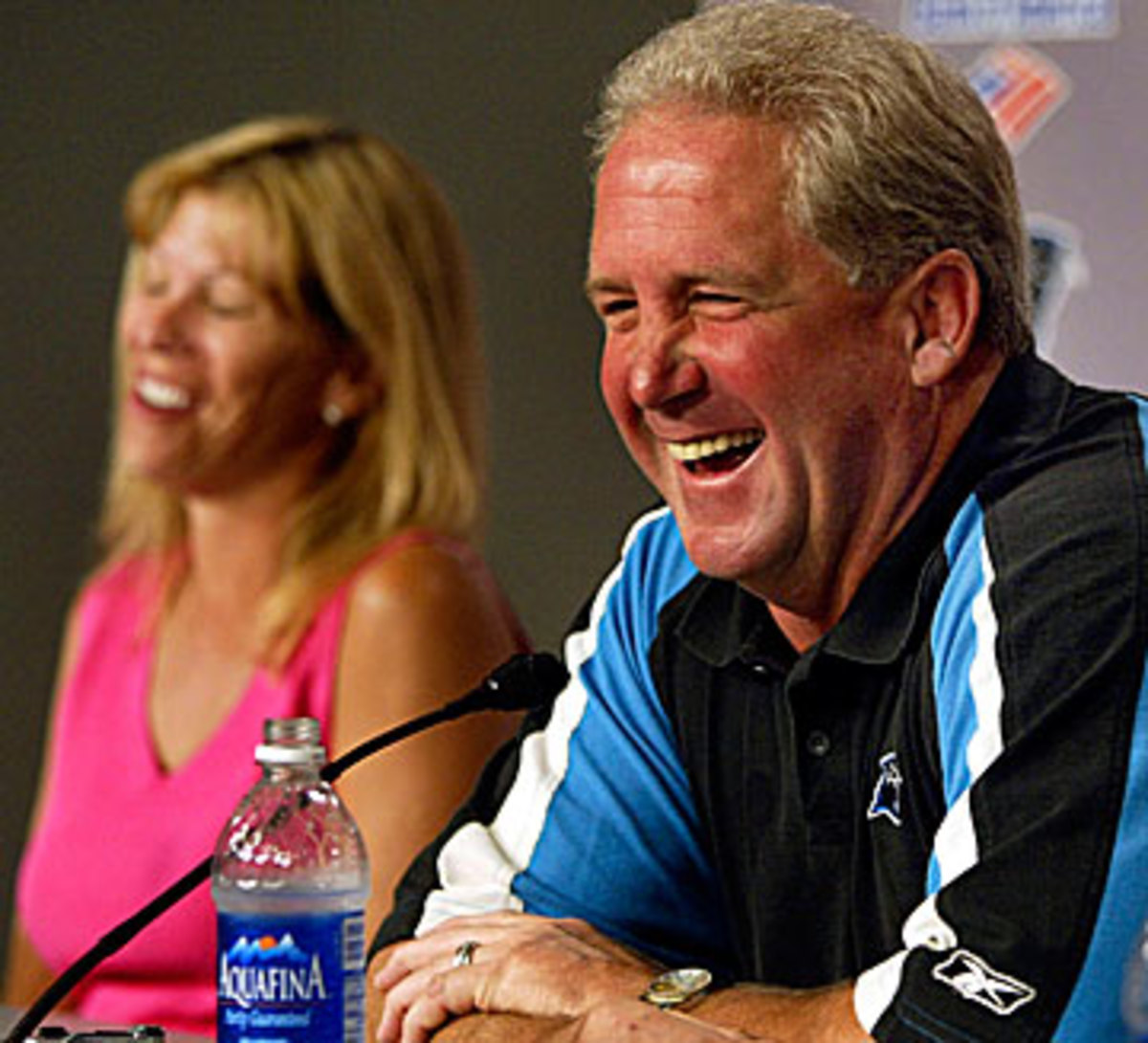 John and Robin Fox share a laugh from John's time as head coach of the Panthers. (Chuck Burton/AP)