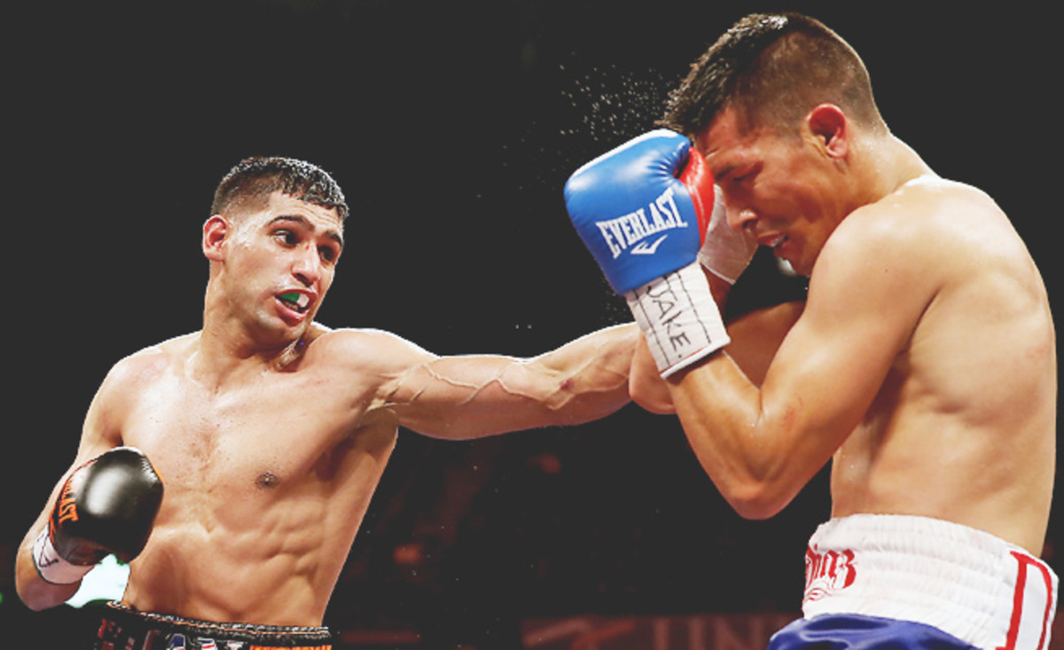 Amir Khan (left) has not fought since beating Julio Diaz by unanimous decision in April.