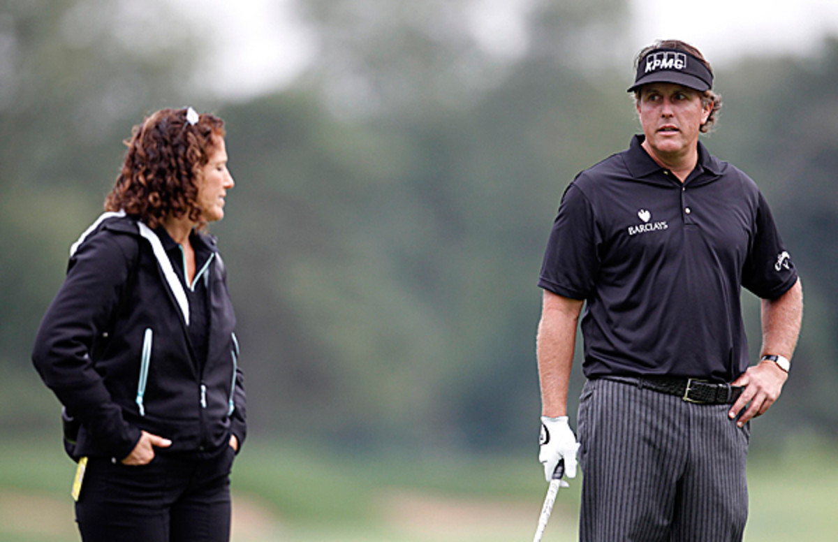 Phil Mickelson talks with sports psychologist Julie Elion before his tee shot at the PGA Tour's FedExCup BMW Championship in 2011.