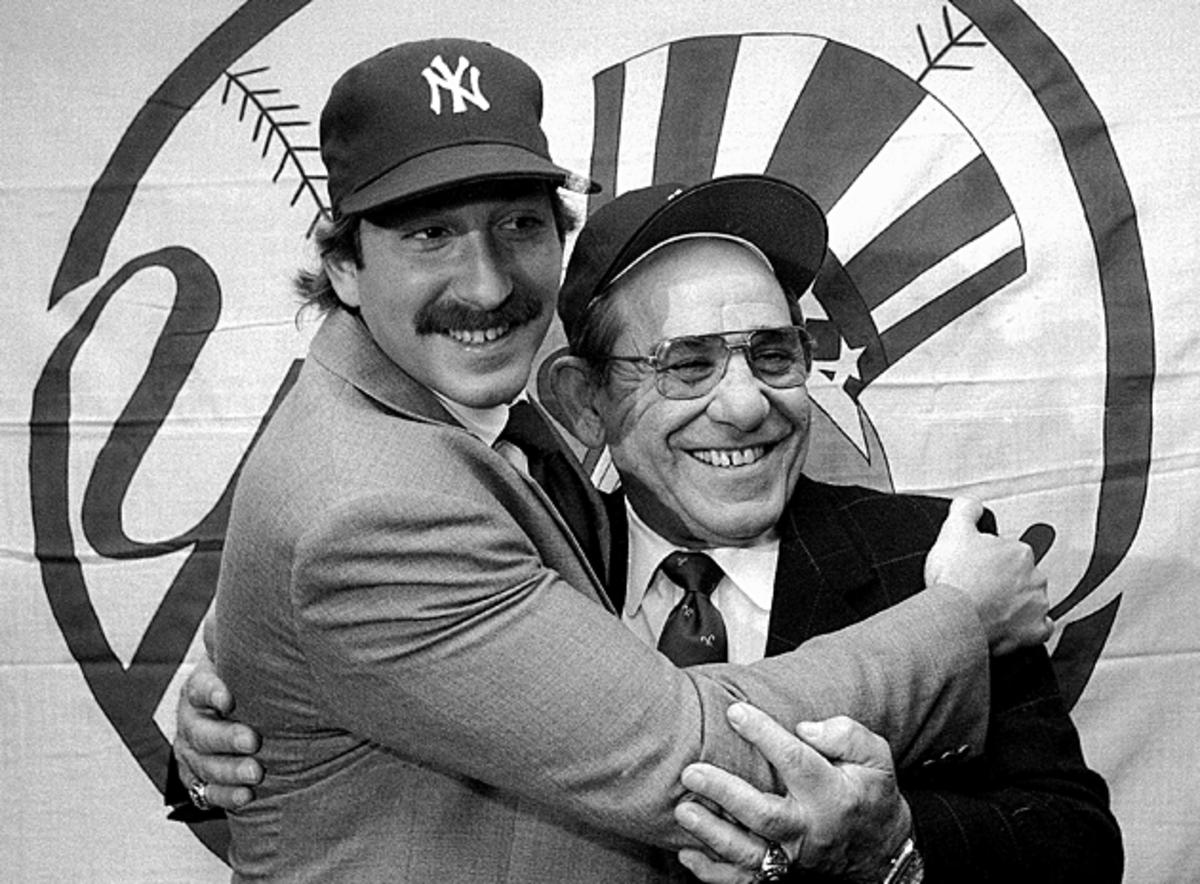 Dale Berra (left), one of Yogi's three children, played for his dad with the Yankees in 1985.