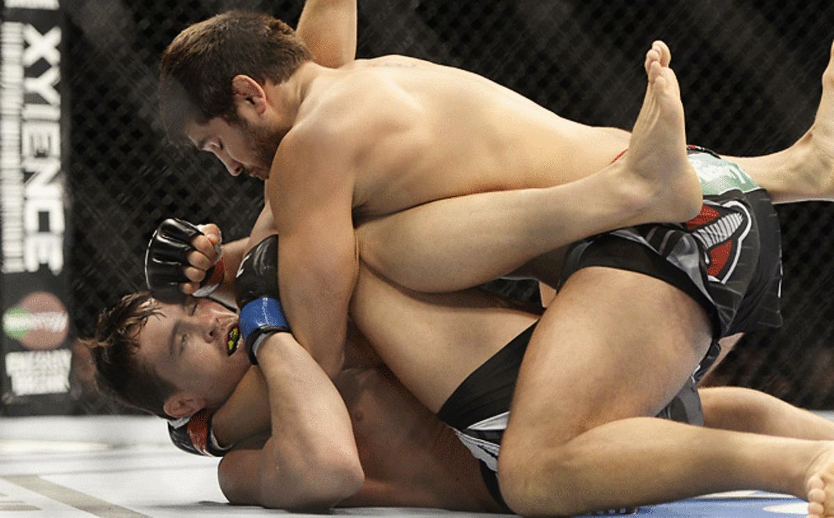 Patrick Cote (red gloves) fights against Kyle Noke during their welterweight bout on Wednesday.
