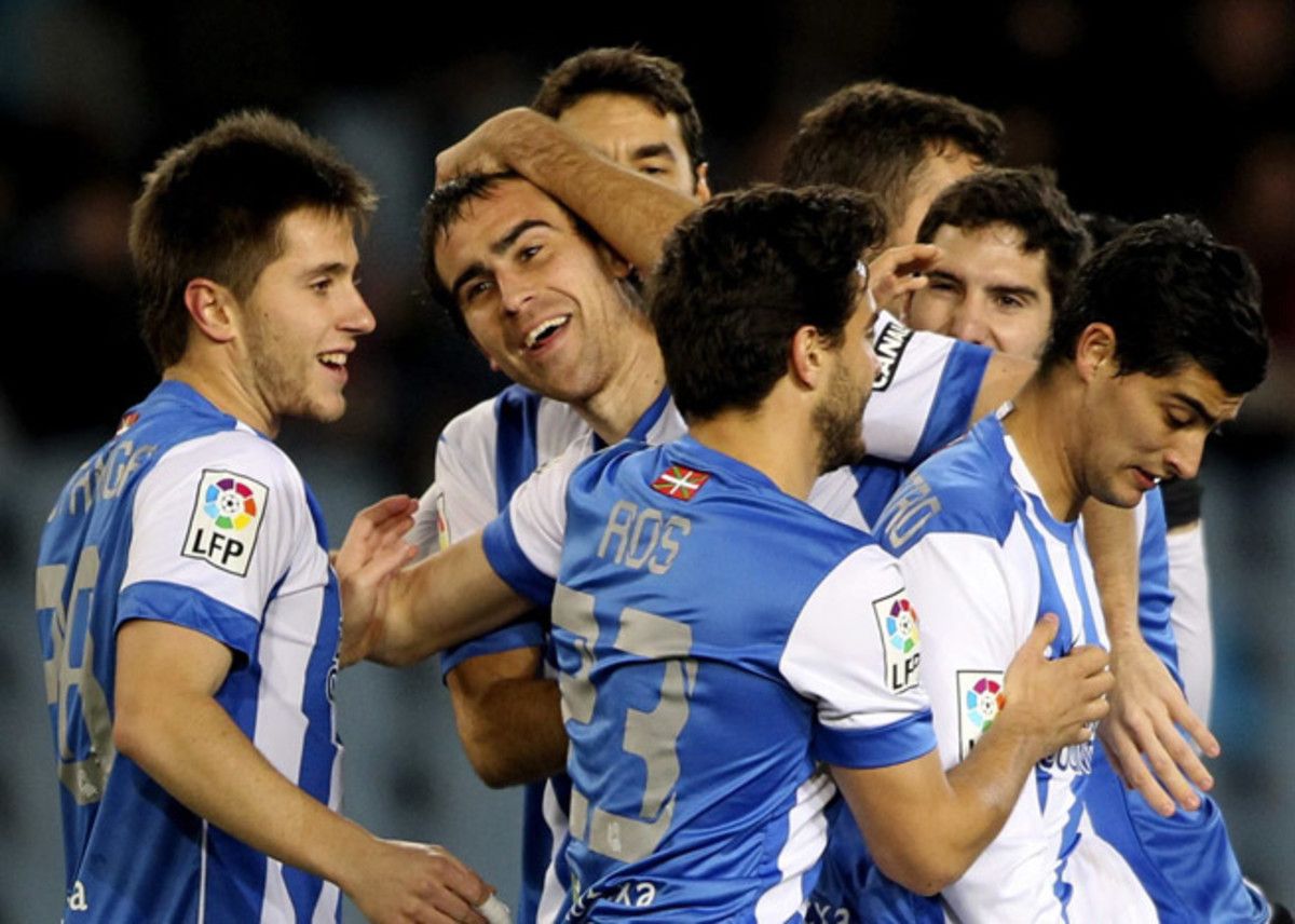Real Sociedad celebrates a goal scored by Mikel Gonzalez, center, during a 3-1 win over Racing Santander in the first leg of their Copa del Rey quarterfinal Wednesday.