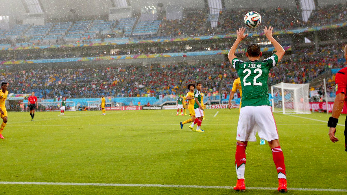Spectators were not immune to the rain in Mexico's soggy 1-0 victory over Cameroon. 