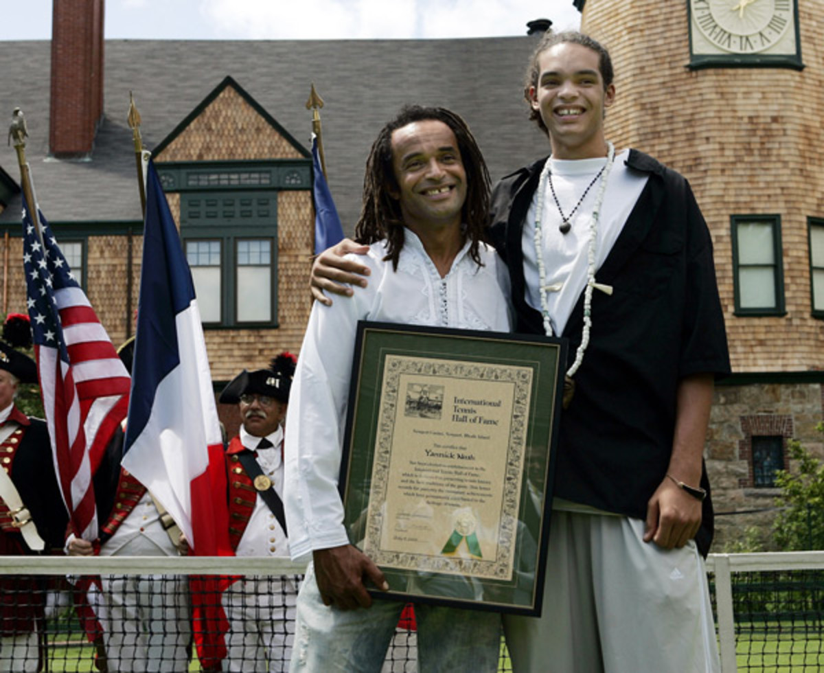 Yannick and Joakim Noah :: AP Photo/Elise Amendola