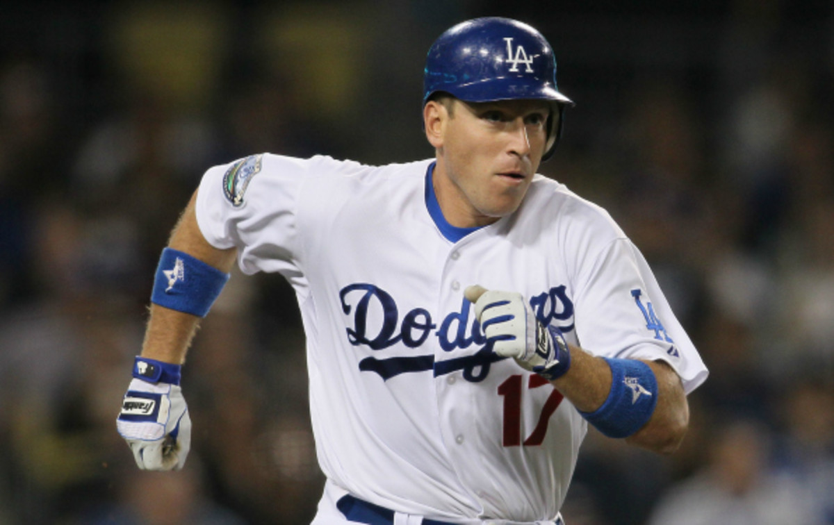 A.J. Ellis injured his knee on Saturday against the San Francisco Giants. (Victor Decolongon/Getty Images)