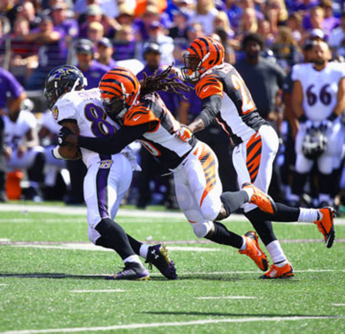 The Bengals’ Reggie Nelson brings down Ravens wideout Steve Smith. (Simon Bruty/SI/The MMQB)