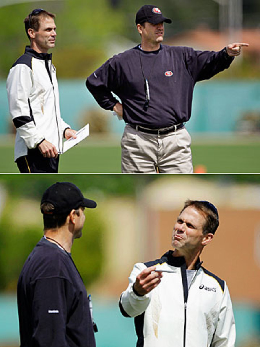 Baalke and Harbaugh on the field during training camp in 2012. (Paul Sakuma/AP)