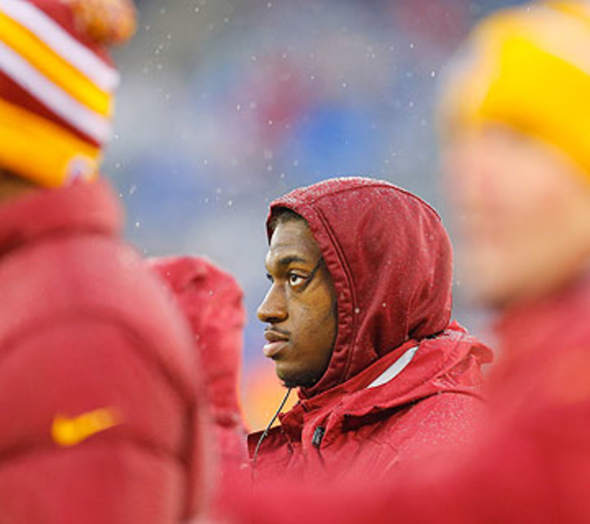 After losing his starting job, Robert Griffin III watched the final two games from the sidelines. (Mike Stobe/Getty Images)