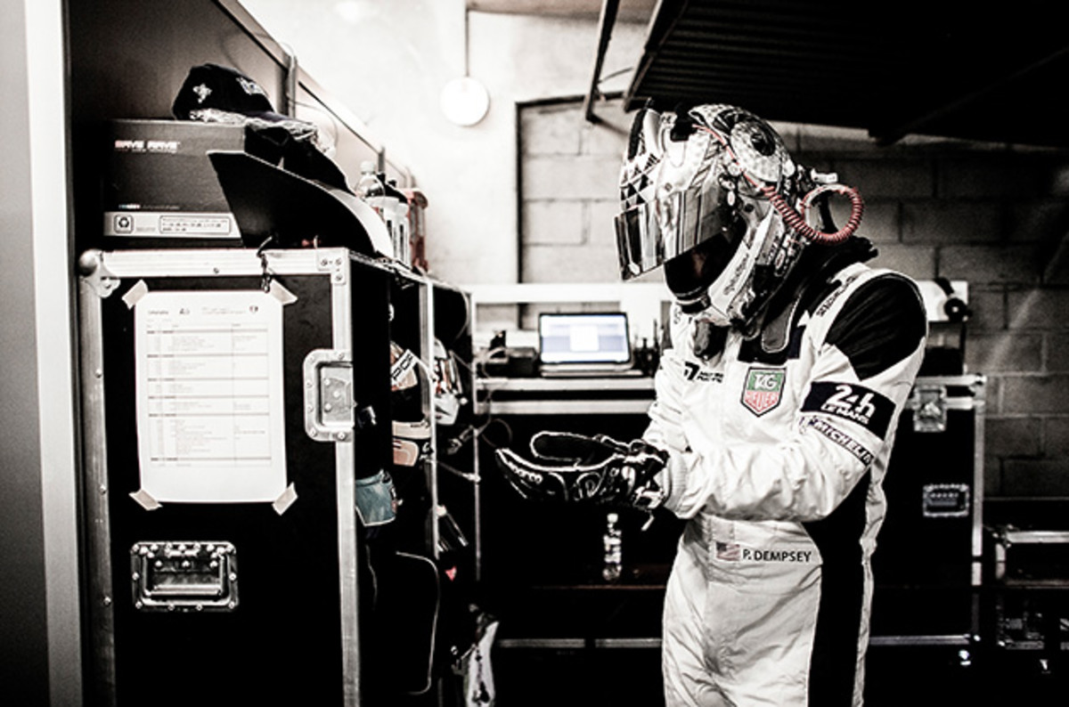 Patrick Dempsey of the USA and Dempsey Racing Proton prepares in the garage ahead of his first stint during the Le Mans 24 Hour Race at Circuit de la Sarthe on June 15, 2014 in Le Mans, France.