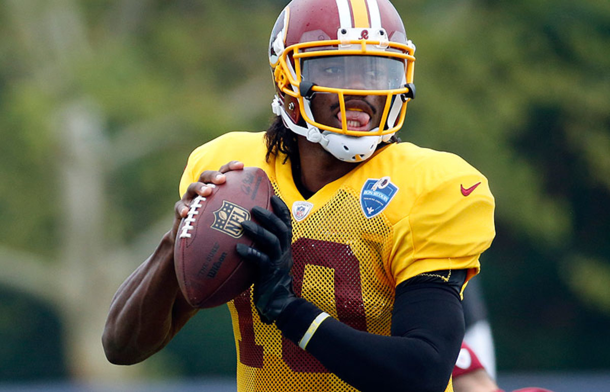 Robert Griffin III arrived at Washington's camp looking to put a roller-coaster first two seasons behind him. (Alex Brandon/AP)