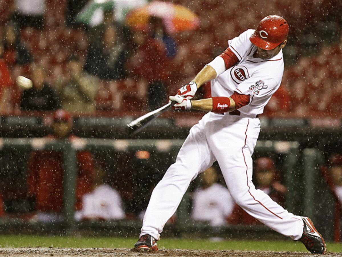 The Reds' Joey Votto blasts one of the 10 home runs during their game against the Pirates. (Al Behrman/AP) 