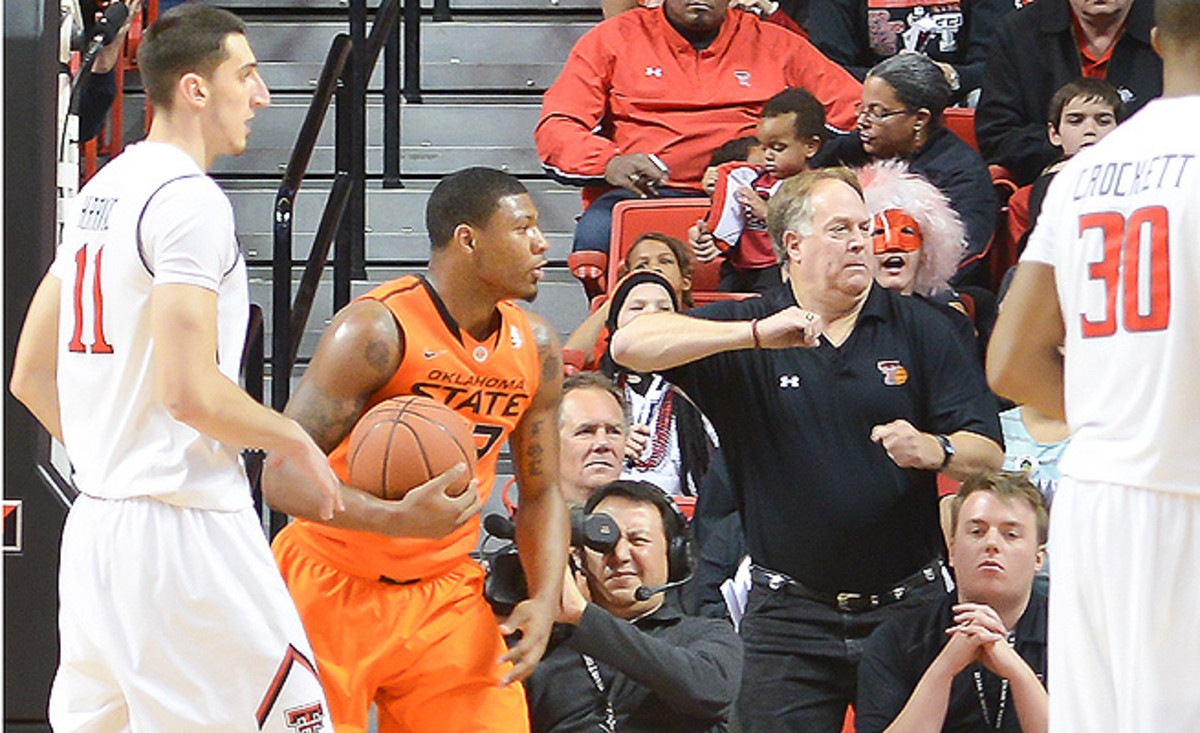 Marcus Smart shoved fan Jeff Orr (center) in the second half of Oklahoma State's loss to Texas Tech.