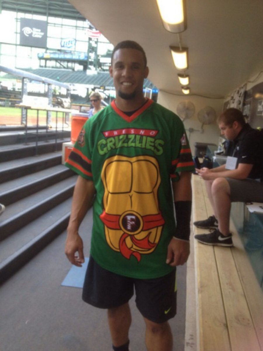 Milwaukee Brewers' Carlos Gomez wears Teenage Mutant Ninja Turtles jersey image