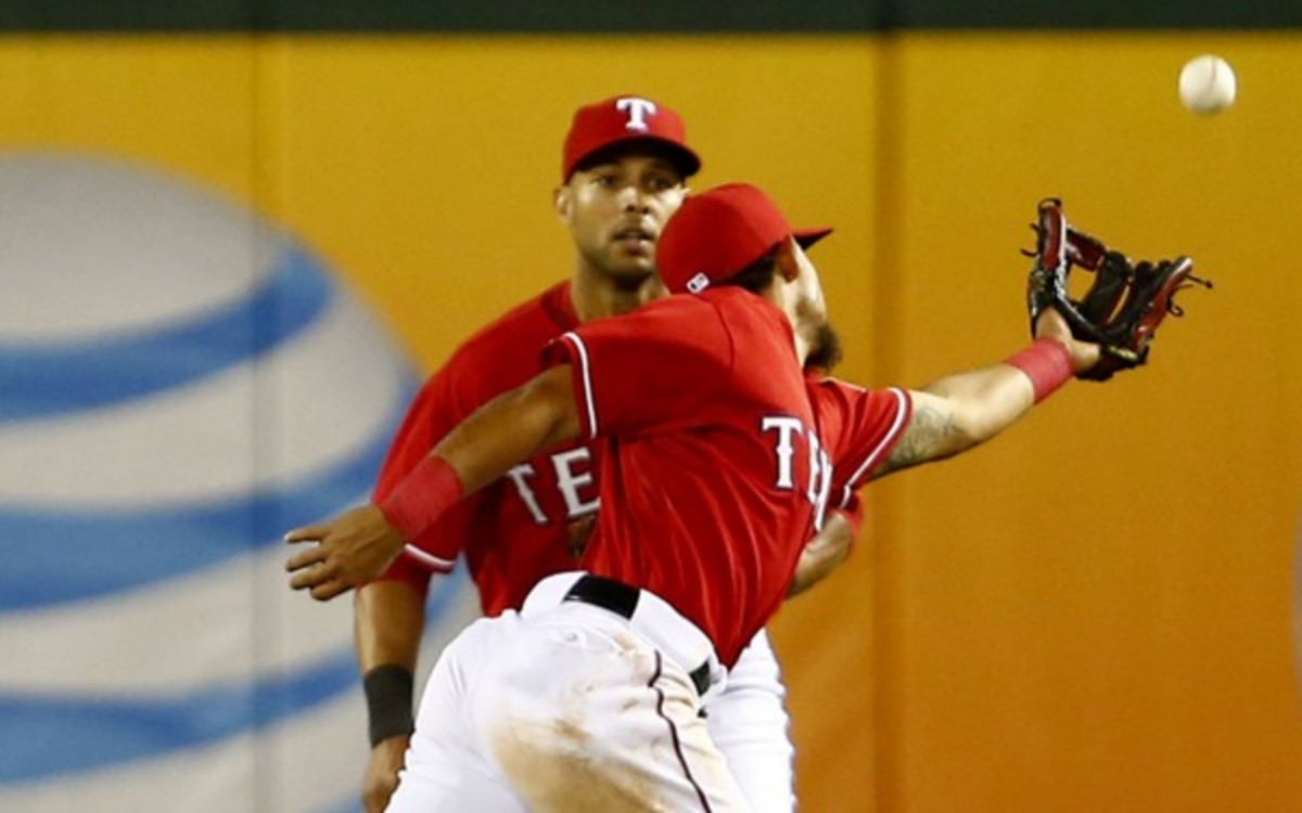 Rougned Odor of the Texas Rangers reaches for a ball that falls between him and Leonys Martin (Ron Jenkins/Fort Worth Star-Telegram/MCT via Getty Images)