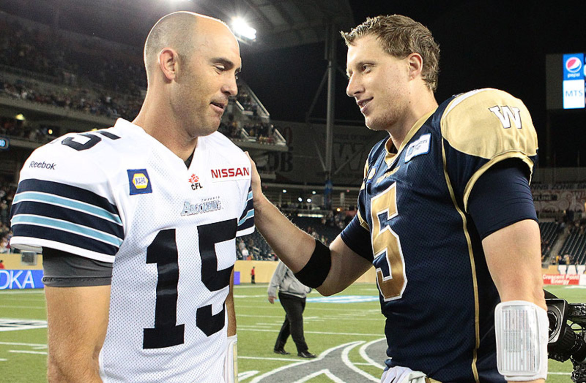 Ricky Ray (left) is a long-time CFL star, but it was first-time starter Drew Willy who shined on CFL's opening night. (Marianne Helm/Getty Images)