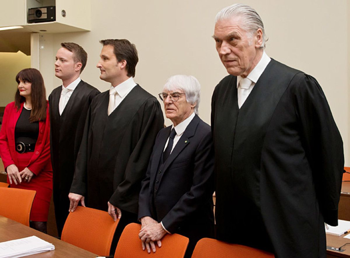 Bernie Ecclestone (second from right) is claiming a German banker put the squeeze on him.