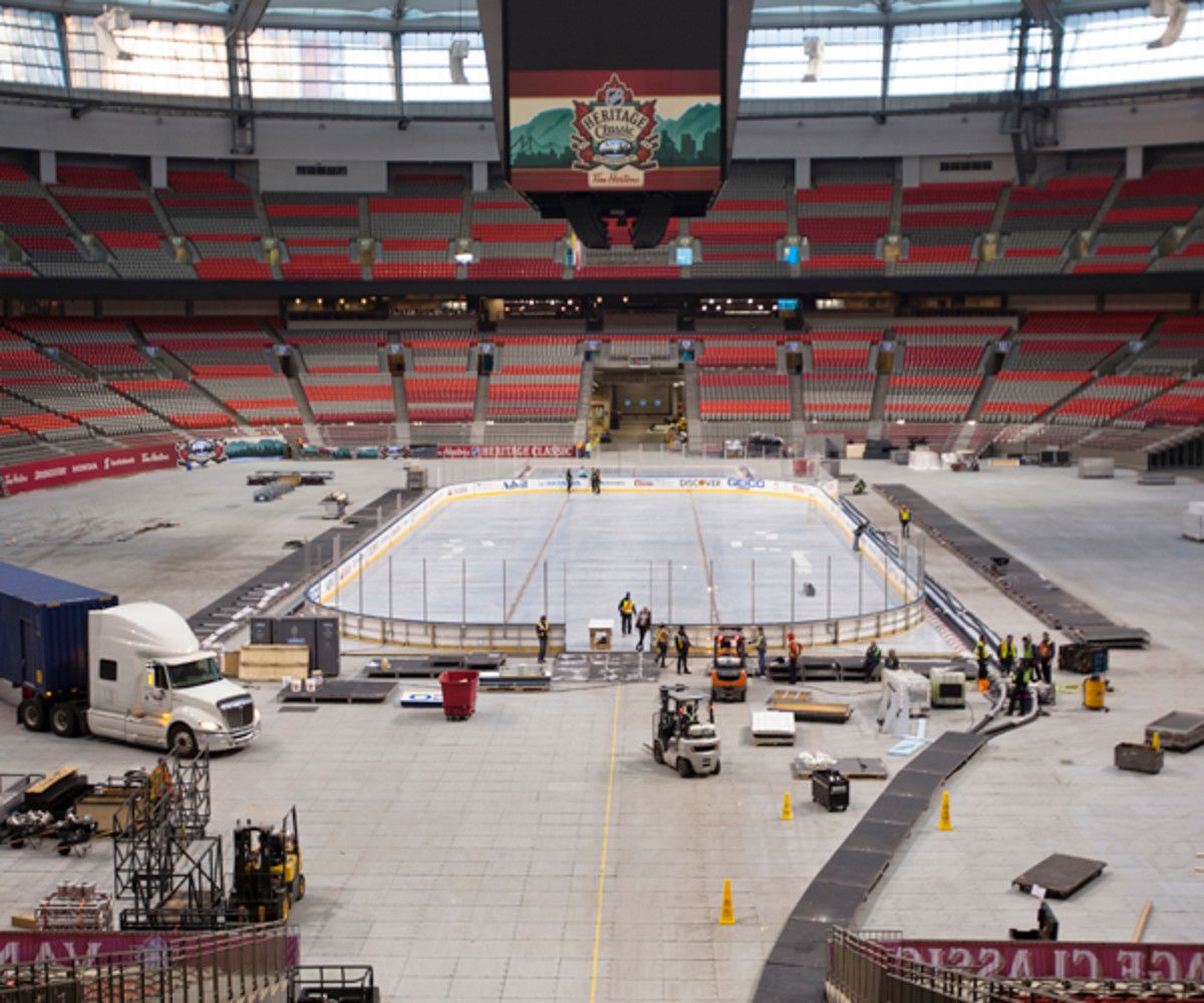 Workers build the rink for the 2014 Heritage Classic Game at B.C. Place in Vancouver, B.C., Canada. (Photo by Kevin Light/NHLI via Getty Images)
