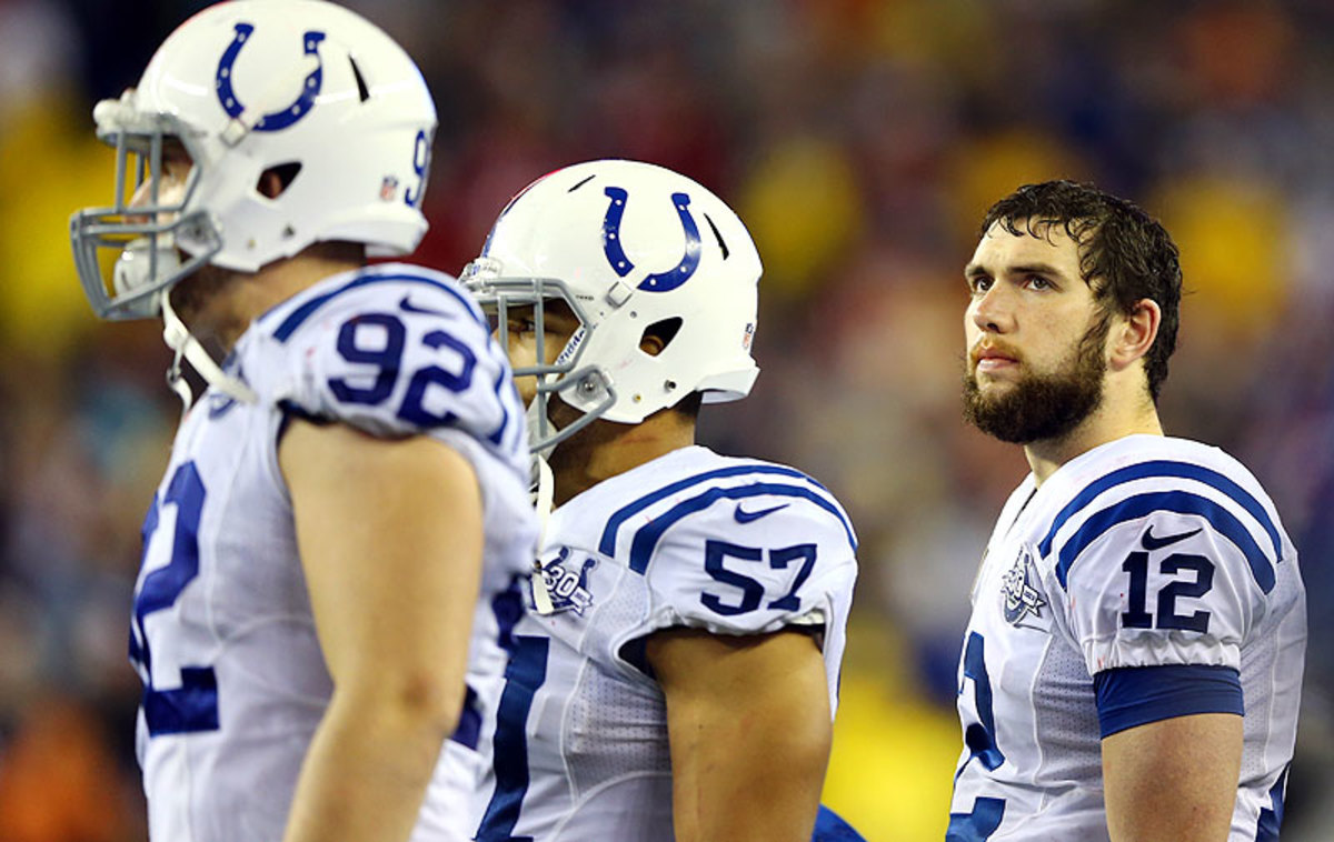 Andrew Luck has led the Colts to the playoffs in each of his first two seasons, but has thrown eight interceptions in three postseason games. (Elsa/Getty Images)