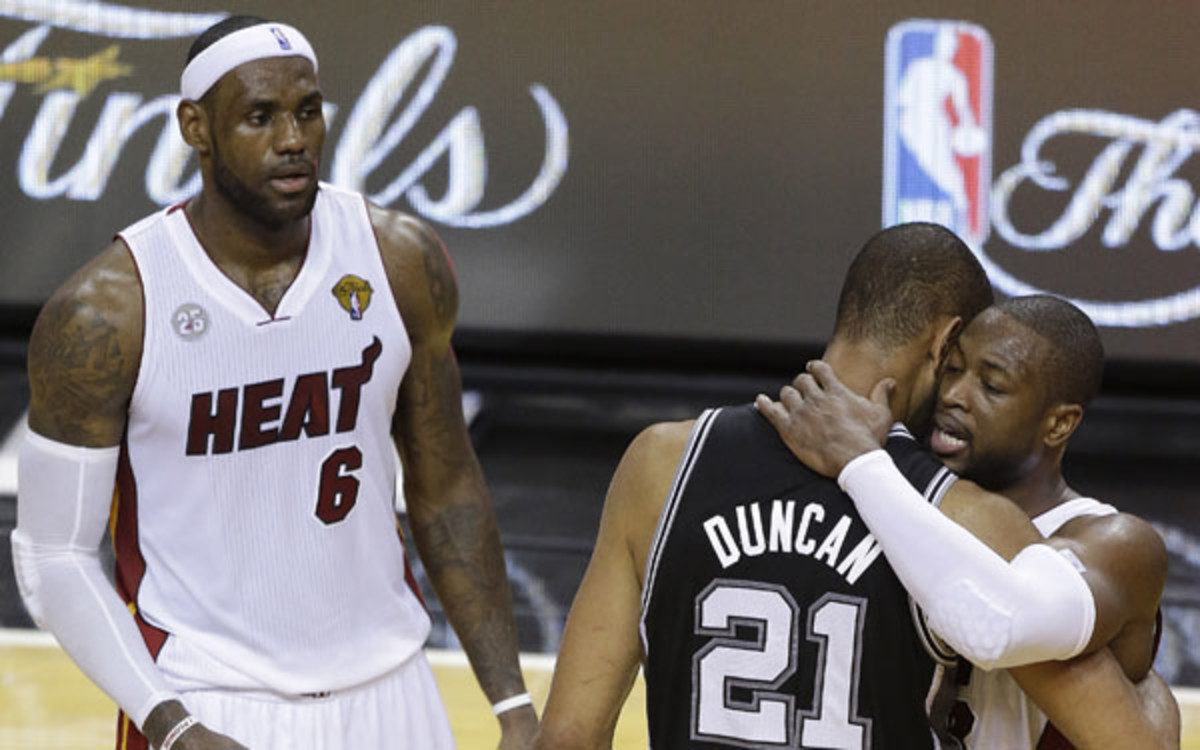 Tim Duncan embraces Dwyane Wade after  the Heat's victory in Game 7 of the 2013 NBA Finals. (AP Photo/Steve Mitchell)
