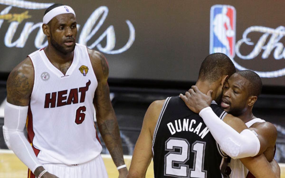 Tim Duncan embraces Dwyane Wade after  the Heat's victory in Game 7 of the 2013 NBA Finals. (AP Photo/Steve Mitchell)