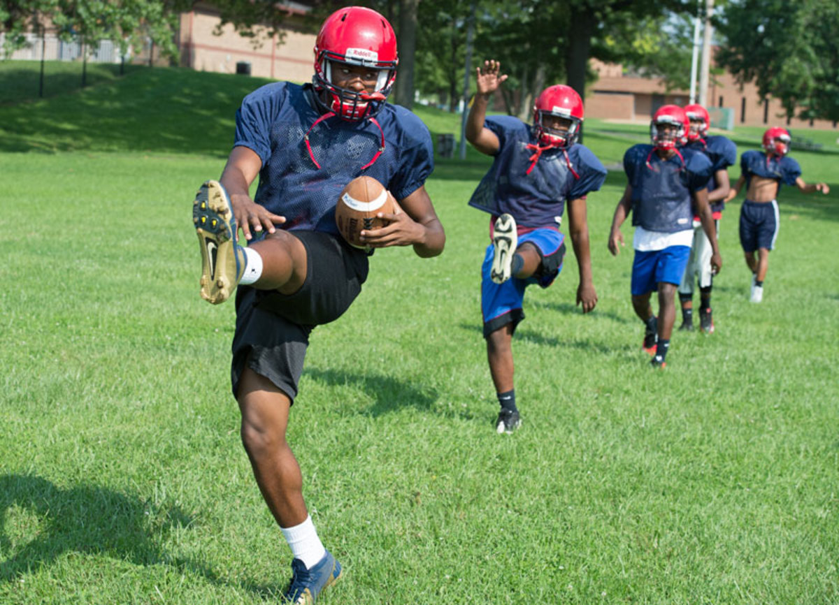 Quarterback Randall Ceaser, leading his teammates in warmups. 