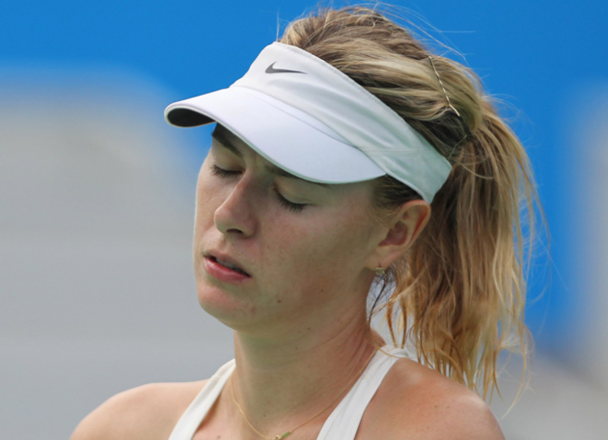 Sharapova reacts after her loss to Bacsinszky.