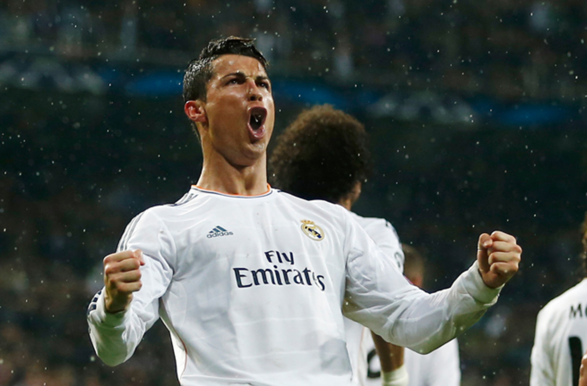 Real Madrid's Cristiano Ronaldo celebrates after his 14th goal of the Champions League campaign, which ties a record.