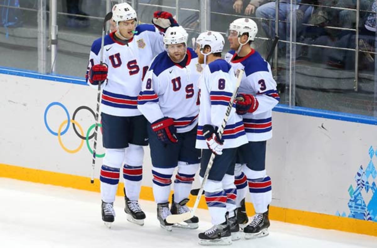 Phil Kessel (second from left) rung up a natural hat trick that launched Team USA's rout.