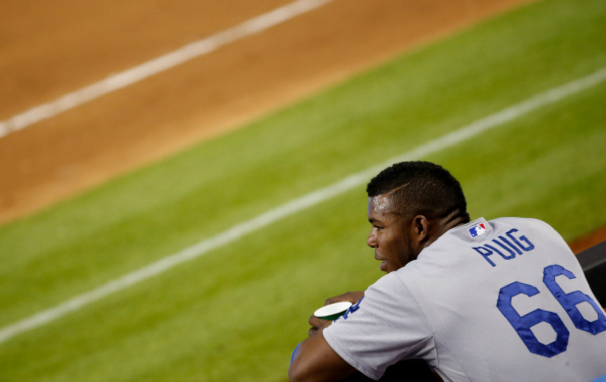 Yasiel Puig is part of a four man outfield platoon with Carl Crawford, Matt Kemp, and Andre Ethier in Los Angeles. (Rob Foldy/Getty Images)