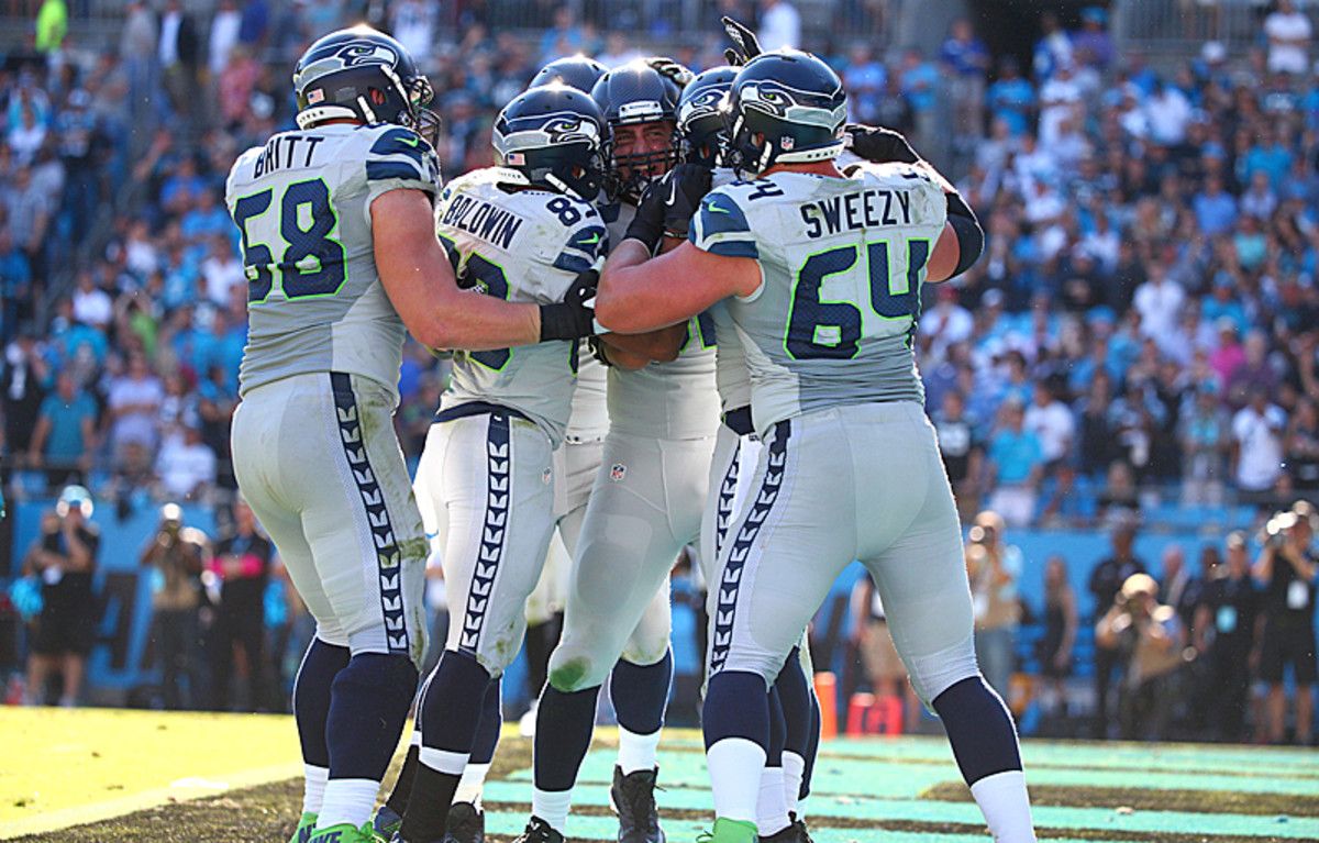 Luke Willson and teammates celebrate the drive that saved the season. (Simon Bruty/SI/The MMQB)