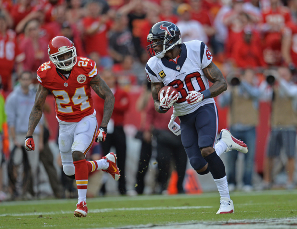 Wide receiver Andre Johnson rushes up field while defensive back Brandon Flowers trails behind him looking for a tackle. 