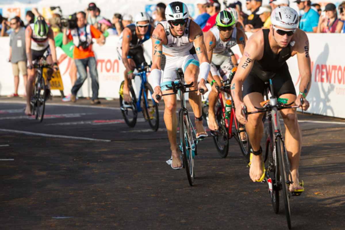 Andrew Starykowicz (52) and Dirk Bockel (47) lead a pack in the bike portion of the Ironman World Championships in October 2013 in Kailua Kona, Hawaii.