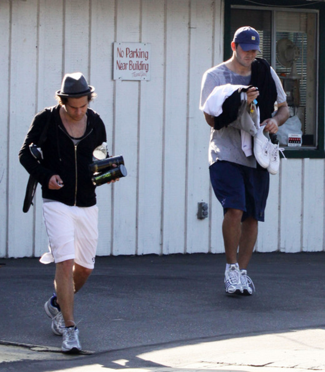 Ryan Cabrera and Romo leave the tennis courts after playing against each other in California.