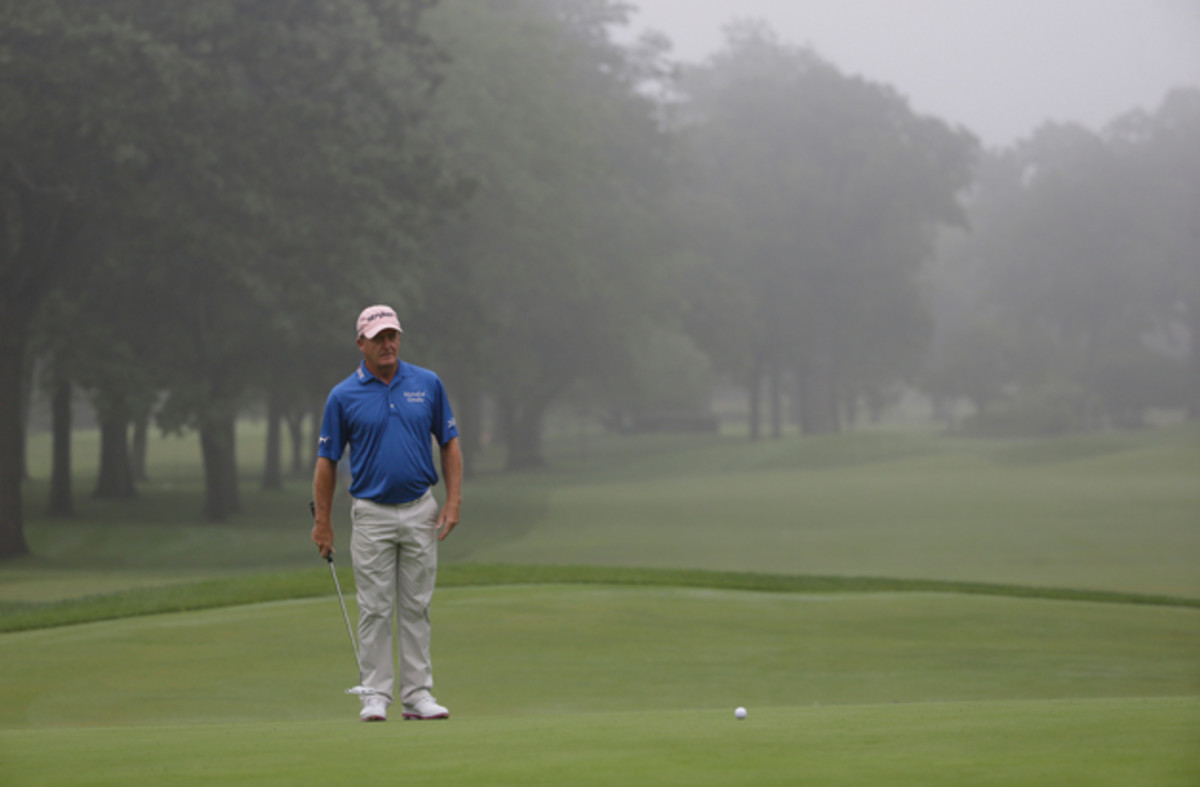 Fred Funk studies the ninth green during the second round of the Encompass Championship golf tournament in Glenview, Ill., Sunday, June 22, 2014.
