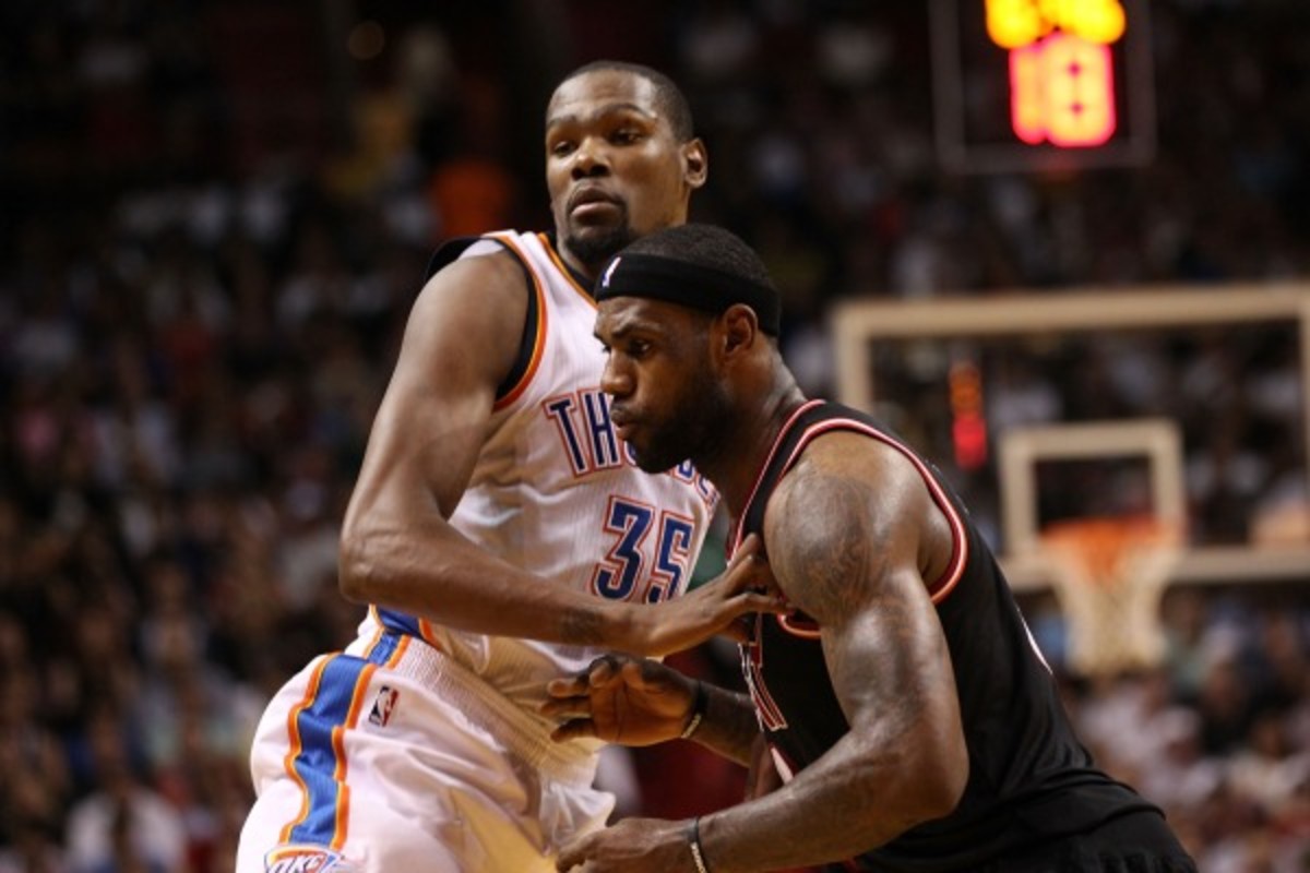 Kevin Durant (left) is averaging five more points per game this season than LeBron James (right). (Marc Serota/Getty Images)