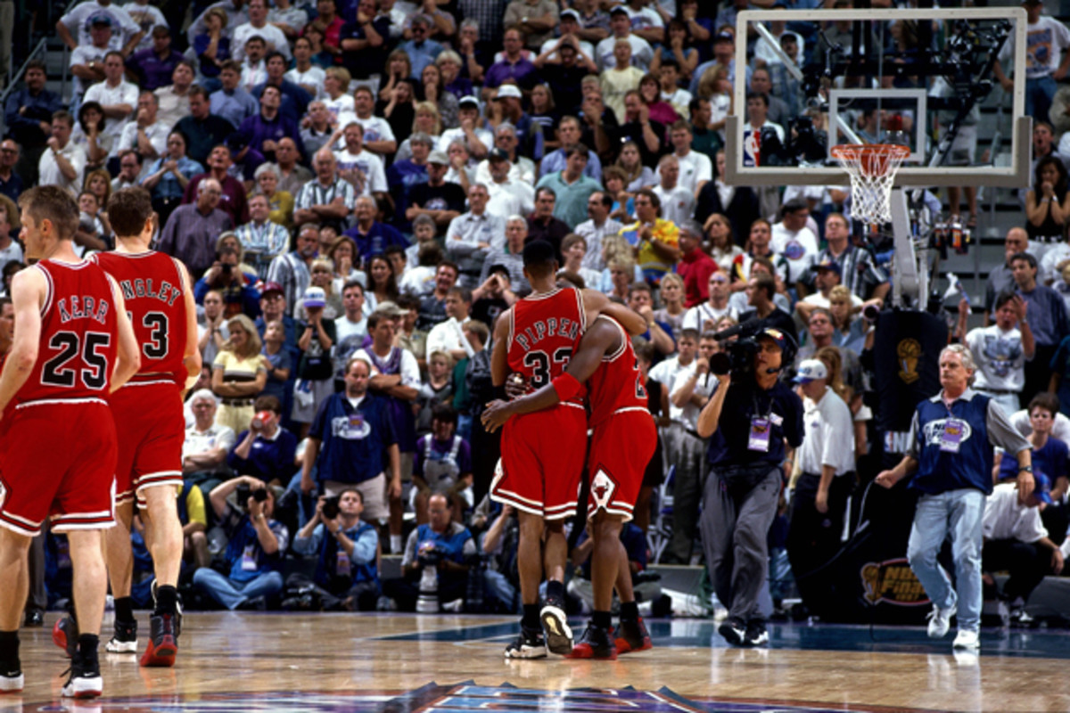 Michael Jordan gets helped off the court by Scottie Pippen during Jordan's infamous "Flu Game" during the 1997 NBA Finals against the Utah Jazz. Grover maintains that he believes Jordan was poisoned, “I’ve never seen a flu hit that quickly.”