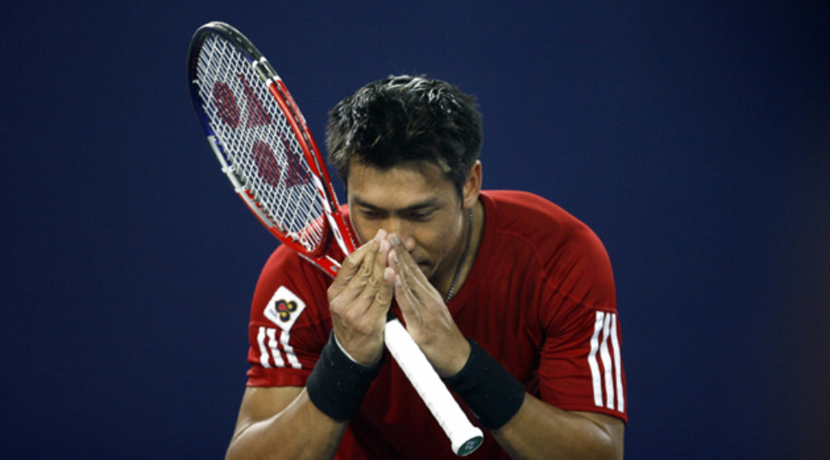 Srichaphan gives his traditional "wai," or bow to the crowd, after a match in Beijing in 2006.