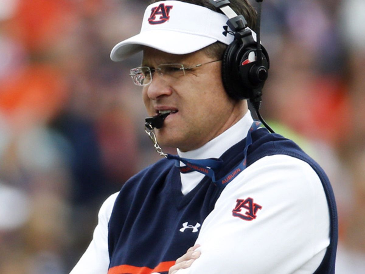 Gus Malzahn's new contract at Auburn extends through the 2019 season. (John Bazemore/AP)