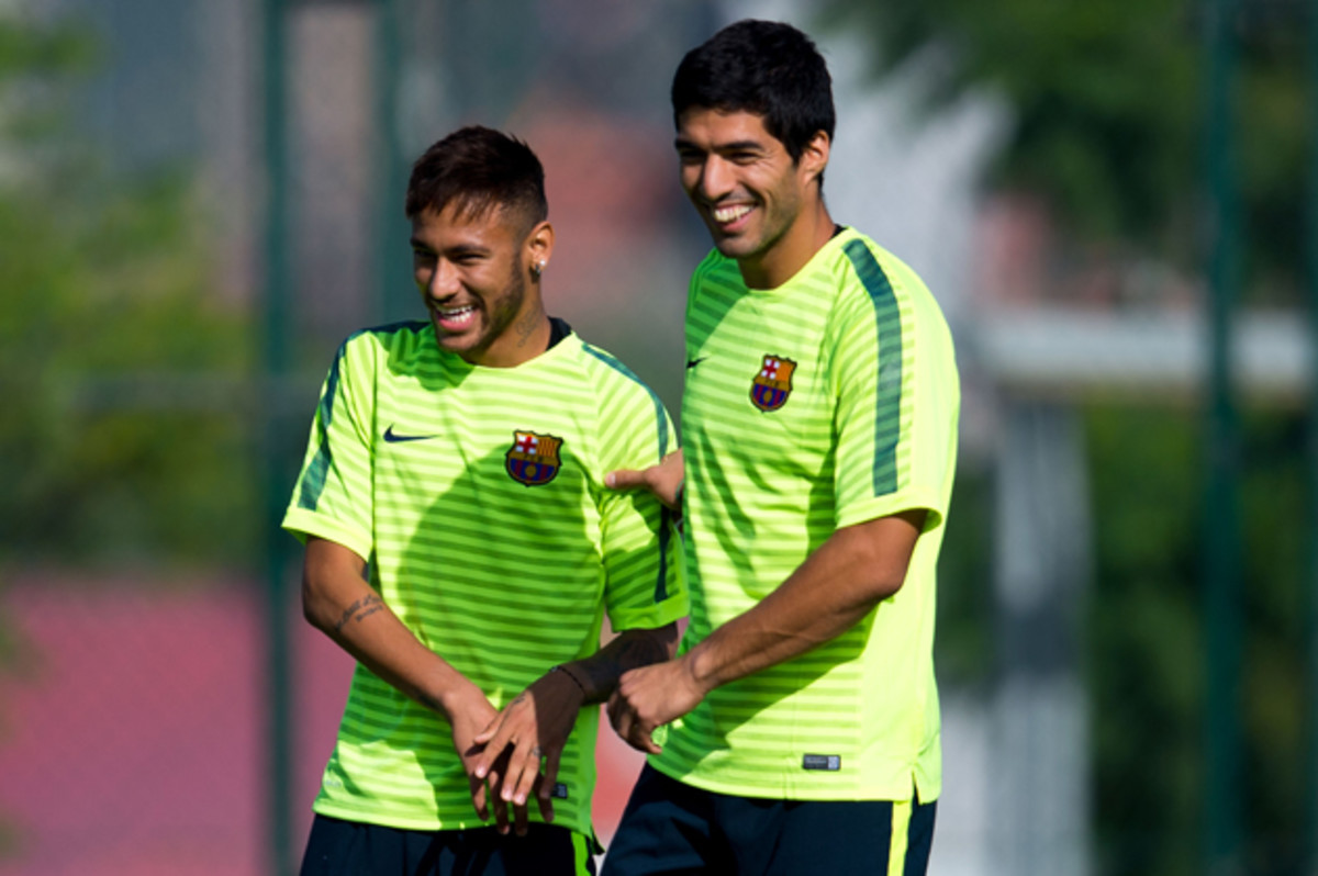 Luis Suarez, right, is set for his Barcelona debut, where he'll team with Neymar, left, and Messi to form a star-studded attacking trident. 